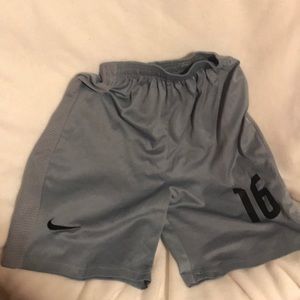 Grey #16 basketball Nike shorts.